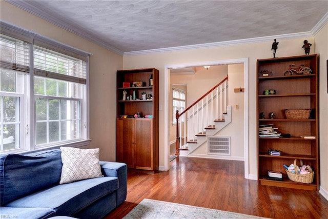 112 Archer Rd, Newport News, VA 23606 - living area featuring wood finished floors, stairs, crown molding, and a wall unit AC