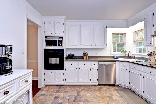 112 Archer Rd, Newport News, VA 23606 - kitchen with stainless steel appliances, white cabinetry, stone finish flooring, and dark countertops