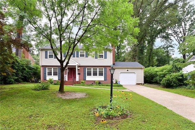 112 Archer Rd, Newport News, VA 23606 - colonial house with a garage, driveway, a front yard, and brick siding