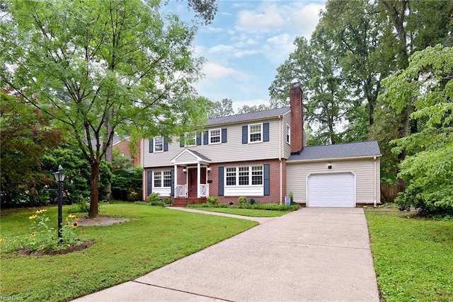 112 Archer Rd, Newport News, VA 23606 - colonial house featuring an attached garage, driveway, a chimney, and brick siding