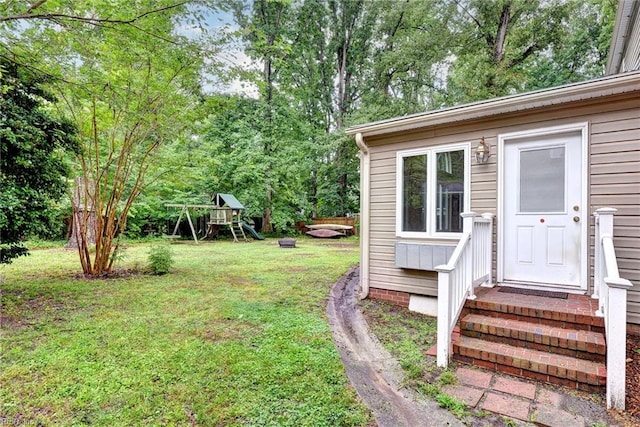 112 Archer Rd, Newport News, VA 23606 - view of grassy yard with a playground and view of wooded area