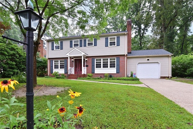112 Archer Rd, Newport News, VA 23606 - colonial-style house with brick siding, a chimney, an attached garage, driveway, and a front yard