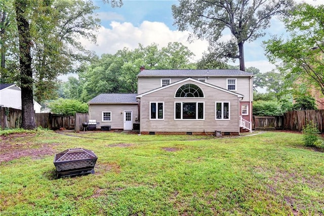 112 Archer Rd, Newport News, VA 23606 - rear view of property featuring an outdoor fire pit, crawl space, a fenced backyard, and a chimney