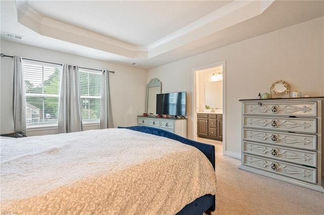 1728 Shorebird Ln, Virginia Beach, VA 23456 - bedroom with a tray ceiling, light colored carpet, and ensuite bathroom