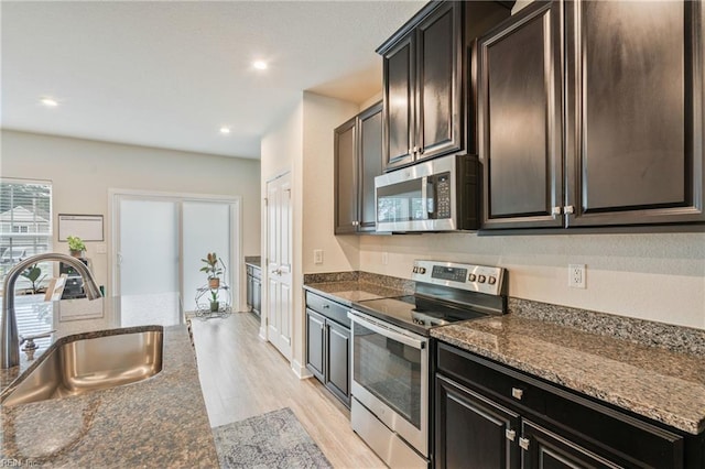 1728 Shorebird Ln, Virginia Beach, VA 23456 - kitchen with appliances with stainless steel finishes, light wood finished floors, dark stone counters, and recessed lighting