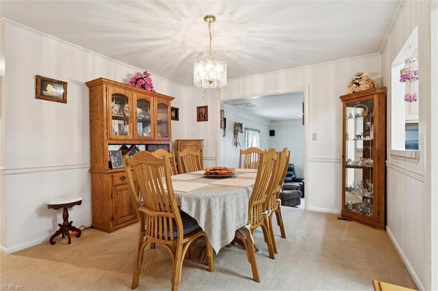 12 Sylvia Ln, Newport News, VA 23602 - dining area featuring light carpet, a chandelier, and crown molding