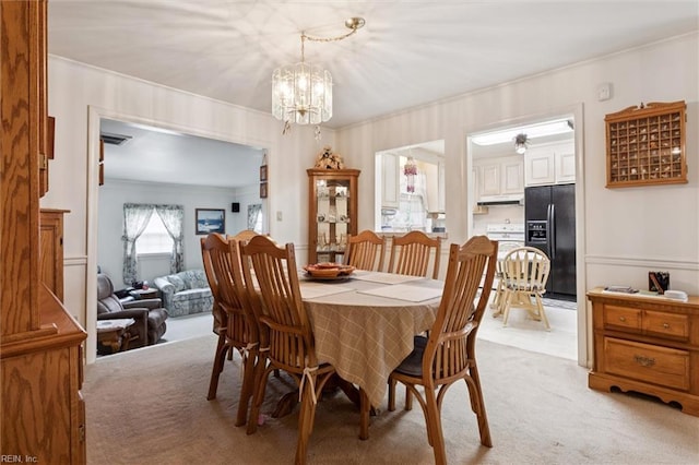 12 Sylvia Ln, Newport News, VA 23602 - dining room with light colored carpet, a chandelier, and ornamental molding