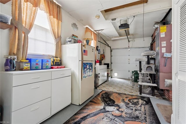 12 Sylvia Ln, Newport News, VA 23602 - garage with freestanding refrigerator and a garage door opener