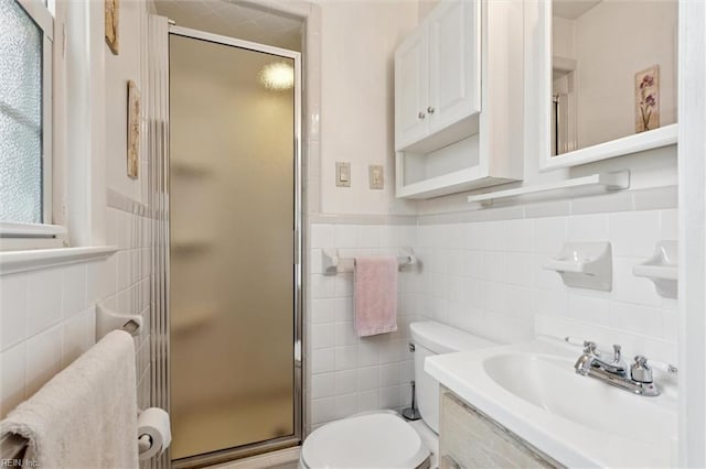 12 Sylvia Ln, Newport News, VA 23602 - bathroom featuring tile walls, a stall shower, vanity, and wainscoting