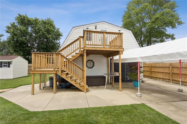 12 Sylvia Ln, Newport News, VA 23602 - rear view of house featuring stairs, a patio, a storage shed, a wooden deck, and a jacuzzi