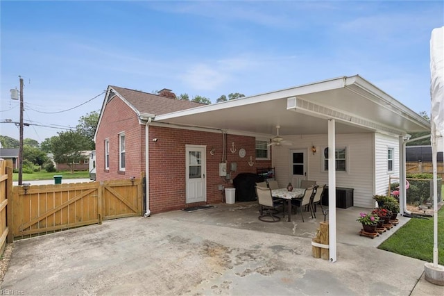12 Sylvia Ln, Newport News, VA 23602 - rear view of property with brick siding, a gate, a patio area, a carport, and ceiling fan