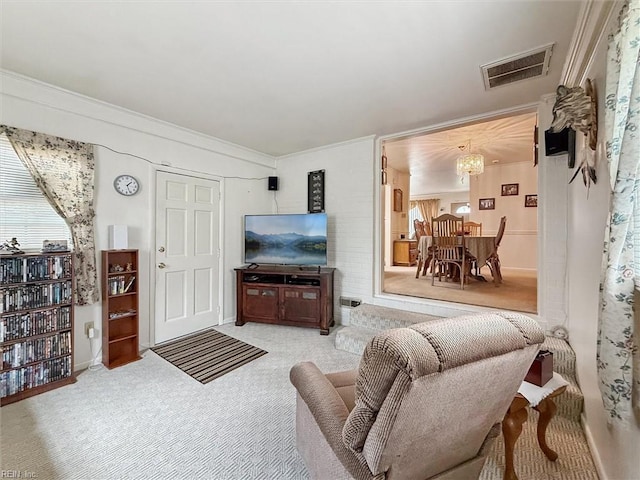 12 Sylvia Ln, Newport News, VA 23602 - carpeted living room with a chandelier and crown molding
