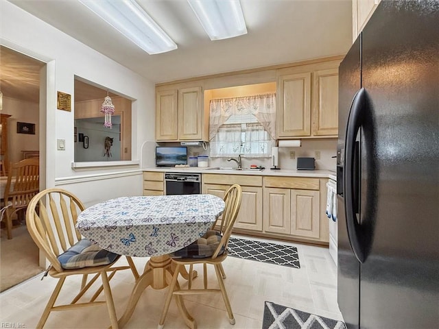 12 Sylvia Ln, Newport News, VA 23602 - kitchen featuring black appliances, light brown cabinetry, light countertops, and light floors