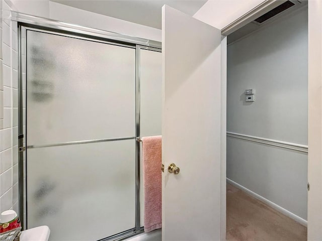 12 Sylvia Ln, Newport News, VA 23602 - bathroom featuring a shower with shower door and baseboards