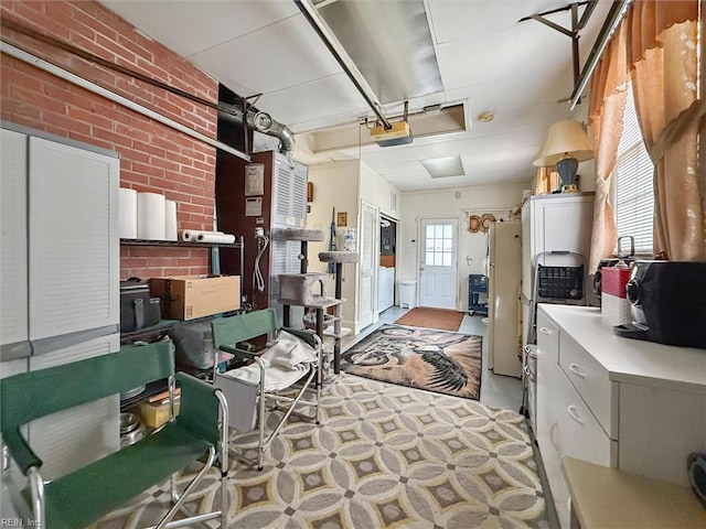 12 Sylvia Ln, Newport News, VA 23602 - garage with freestanding refrigerator, a garage door opener, and a porch
