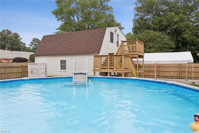 12 Sylvia Ln, Newport News, VA 23602 - view of swimming pool with stairs, a fenced backyard, and a wooden deck