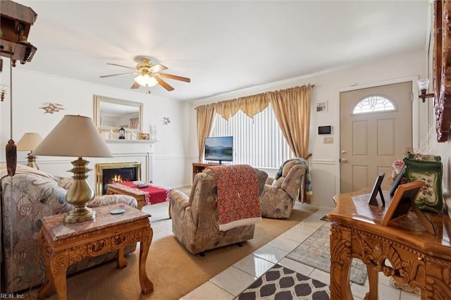 12 Sylvia Ln, Newport News, VA 23602 - living room featuring light tile patterned flooring, ceiling fan, and a warm lit fireplace