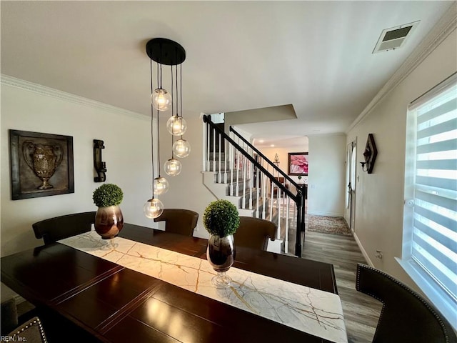 120 Lancelot Dr, Suffolk, VA 23434 - dining space with stairs, wood finished floors, and crown molding