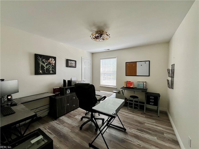 120 Lancelot Dr, Suffolk, VA 23434 - home office with dark wood-style flooring and baseboards