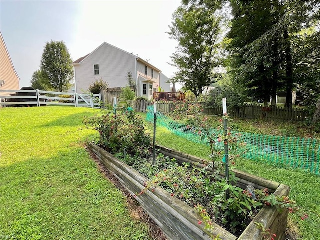 120 Lancelot Dr, Suffolk, VA 23434 - fenced backyard with a garden