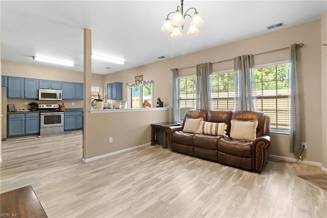 3904 River Breeze Cir, Chesapeake, VA 23321 - living area with a chandelier and light wood finished floors