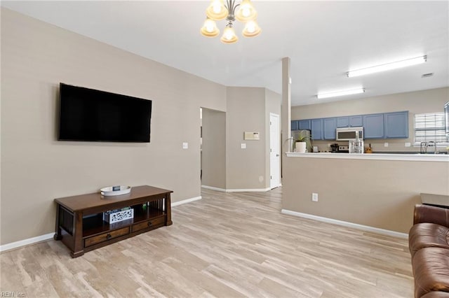 3904 River Breeze Cir, Chesapeake, VA 23321 - living area featuring light wood-style floors and a chandelier