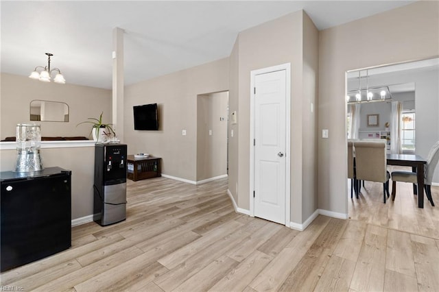 3904 River Breeze Cir, Chesapeake, VA 23321 - kitchen featuring light wood-style floors, a chandelier, and fridge
