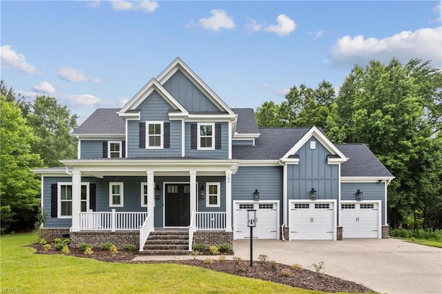 104 Tucker Ct, Carrollton, VA 23314 - craftsman-style home featuring board and batten siding, driveway, covered porch, a garage, and a front lawn