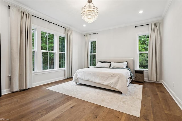 104 Tucker Ct, Carrollton, VA 23314 - bedroom featuring ornamental molding, multiple windows, dark wood-style floors, recessed lighting, and a chandelier