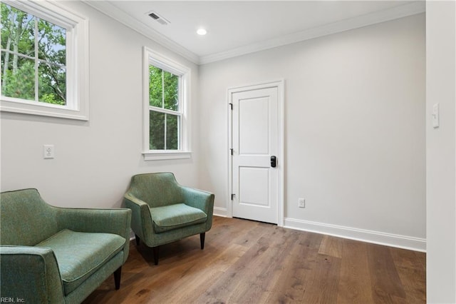 104 Tucker Ct, Carrollton, VA 23314 - living area featuring crown molding, wood finished floors, and recessed lighting