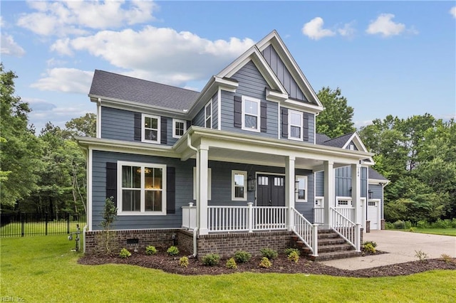 104 Tucker Ct, Carrollton, VA 23314 - craftsman house with a porch, driveway, and board and batten siding
