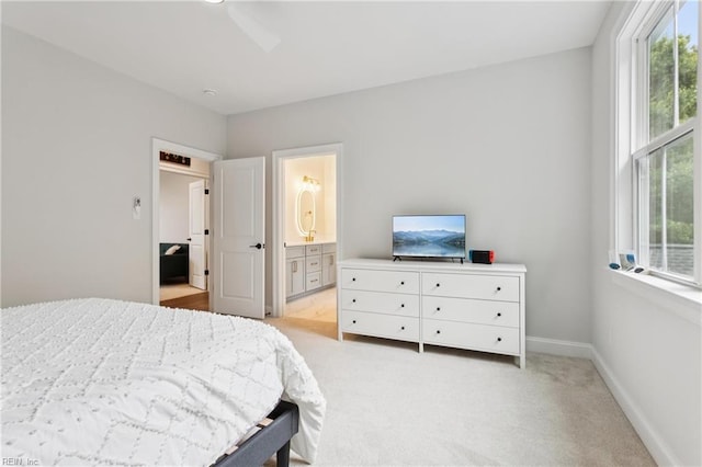 104 Tucker Ct, Carrollton, VA 23314 - bedroom featuring light colored carpet, multiple windows, and connected bathroom