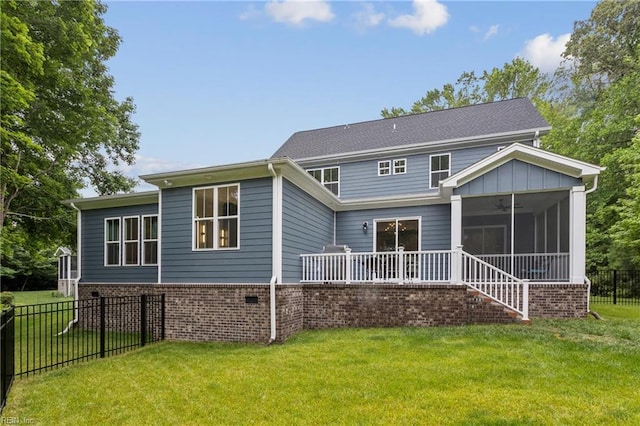 104 Tucker Ct, Carrollton, VA 23314 - back of house featuring a sunroom, ceiling fan, and brick siding