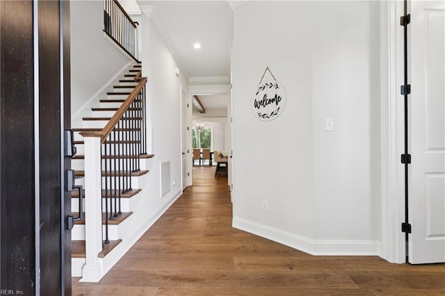 104 Tucker Ct, Carrollton, VA 23314 - foyer entrance with wood finished floors, recessed lighting, stairway, and crown molding