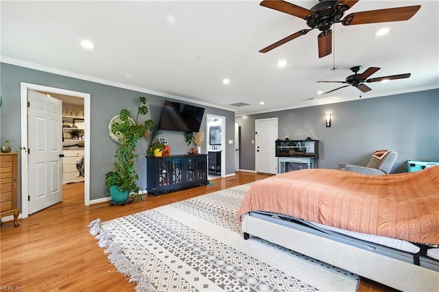 16 Inglewood Dr, Hampton, VA 23666 - bedroom with ornamental molding, recessed lighting, wood finished floors, a ceiling fan, and a walk in closet