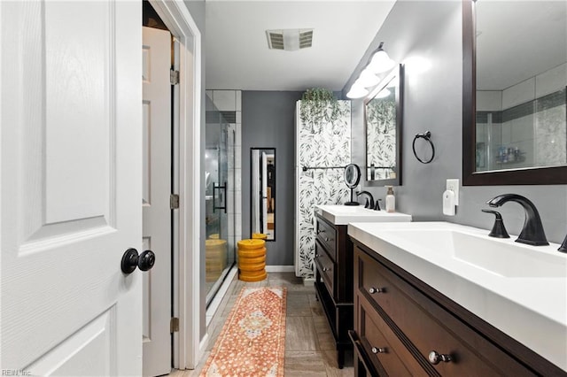 16 Inglewood Dr, Hampton, VA 23666 - bathroom featuring a shower stall and two vanities