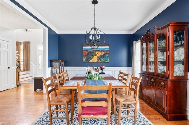 101 Ryder, Smithfield, VA 23430 - dining area featuring a chandelier, light wood-style floors, stairway, wainscoting, and crown molding
