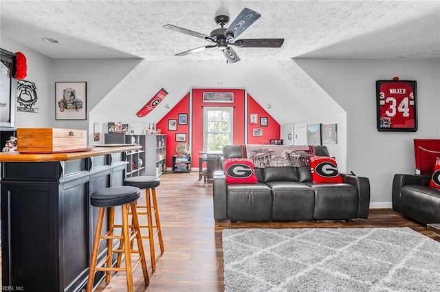 101 Ryder, Smithfield, VA 23430 - living room featuring a ceiling fan, wood finished floors, a textured ceiling, a dry bar, and vaulted ceiling