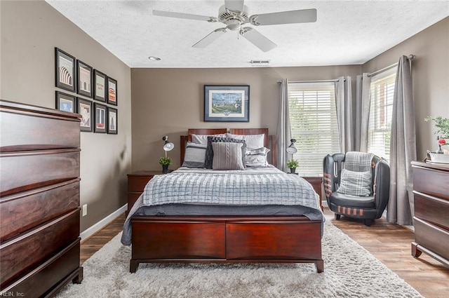 101 Ryder, Smithfield, VA 23430 - bedroom featuring wood finished floors, a textured ceiling, and ceiling fan