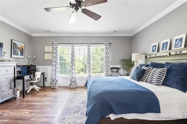 101 Ryder, Smithfield, VA 23430 - bedroom featuring wood finished floors, a textured ceiling, ornamental molding, a wainscoted wall, and ceiling fan