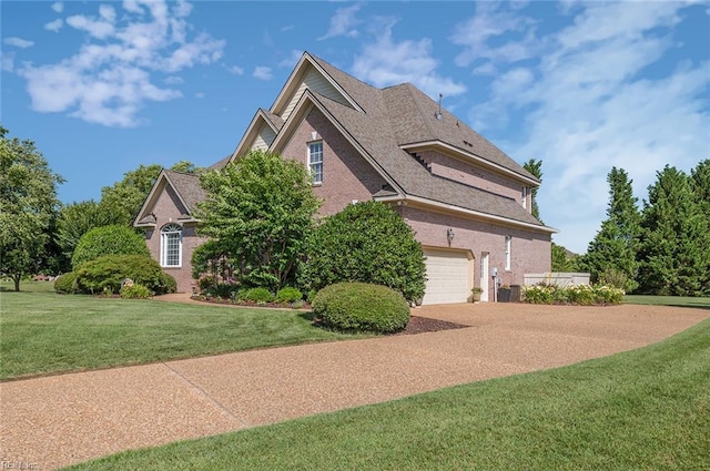 101 Ryder, Smithfield, VA 23430 - view of home's exterior with brick siding, concrete driveway, an attached garage, and a yard