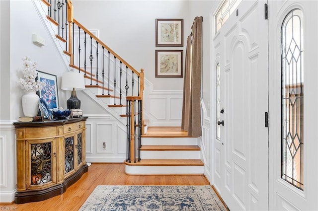101 Ryder, Smithfield, VA 23430 - foyer featuring a decorative wall, light wood-style flooring, stairway, healthy amount of natural light, and wainscoting