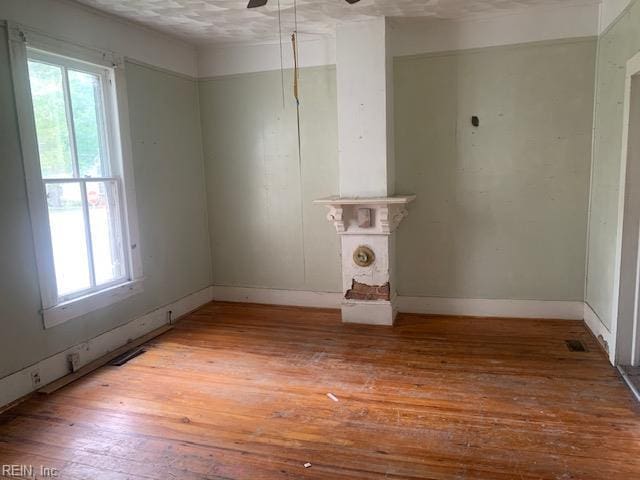 603 N High St, Franklin, VA 23851 - empty room featuring healthy amount of natural light, wood-type flooring, and ceiling fan