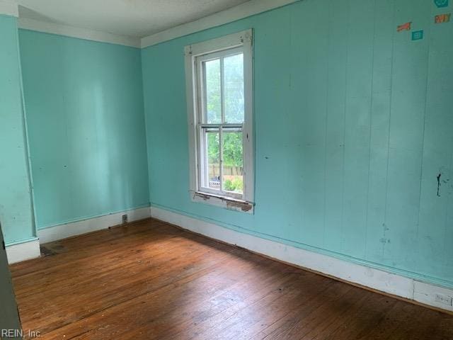 603 N High St, Franklin, VA 23851 - empty room with hardwood / wood-style flooring and baseboards