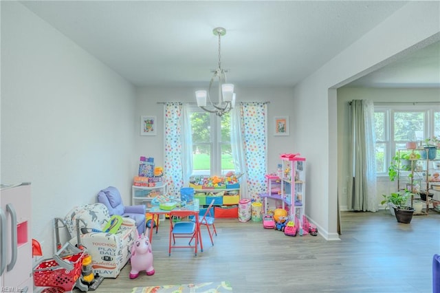2028 Hickorywood Dr, Suffolk, VA 23434 - playroom with a chandelier and wood finished floors