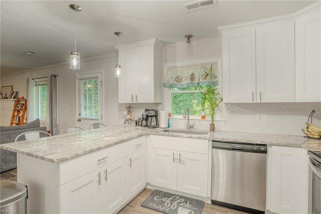 2028 Hickorywood Dr, Suffolk, VA 23434 - kitchen with dishwasher, a peninsula, white cabinetry, light stone countertops, and ornamental molding