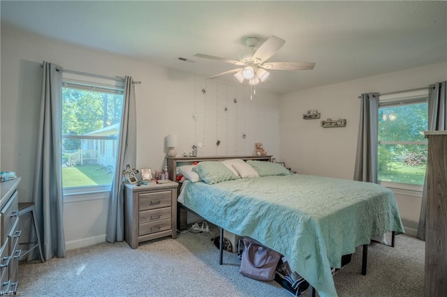 2028 Hickorywood Dr, Suffolk, VA 23434 - carpeted bedroom with multiple windows and a ceiling fan