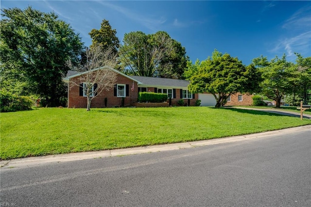 2028 Hickorywood Dr, Suffolk, VA 23434 - ranch-style house featuring a front yard, brick siding, and an attached garage