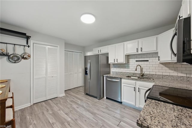 2601 Shell Rd, Hampton, VA 23661 - kitchen featuring stainless steel appliances, white cabinetry, tasteful backsplash, and light stone counters