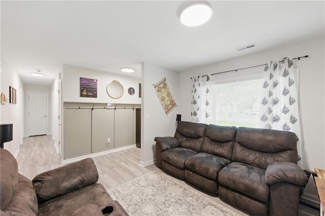 2601 Shell Rd, Hampton, VA 23661 - living room featuring light wood finished floors and baseboards